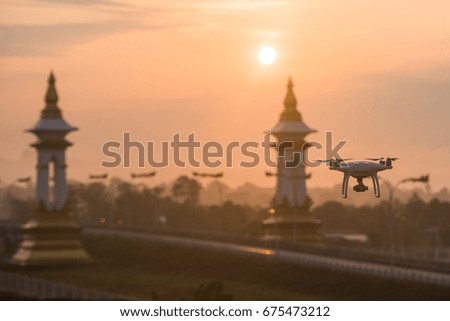 Flying drone and remote control natural background 