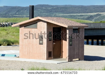 A pre-fabricated concrete outhouse of the type used by the National Park Service, and the National forest service in the United states.