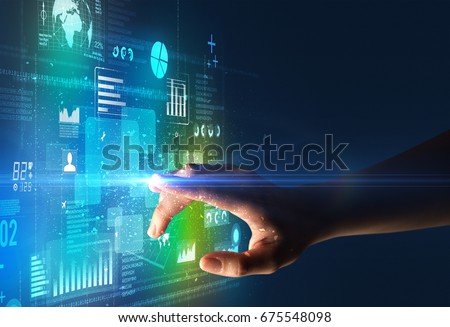 Female finger touching a beam of light surrounded by blue and green data and charts Royalty-Free Stock Photo #675548098
