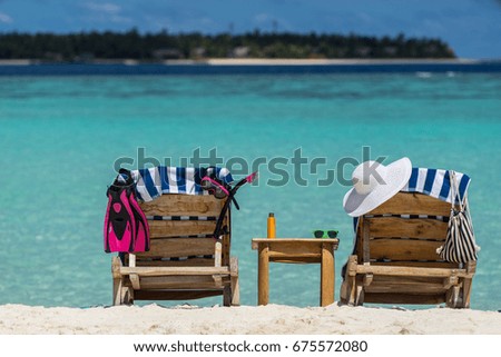 Picture of wooden beach chairs on the tropical beach, vacation. Traveler dreams concept
