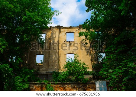 The wall of a ruined building with windows. Background.