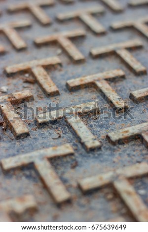 Extreme Close up Rusty Grey T Shape Metal Floor, Industrial Manhole Background