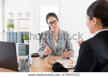beautiful young business sales woman introducing company new product for partner but female manager feeling unsatisfied and refusing signing deal.