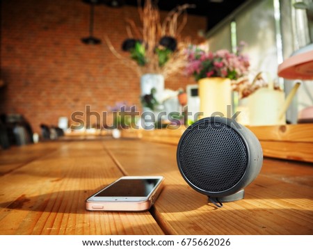 Bluetooth speaker with smart phone Royalty-Free Stock Photo #675662026