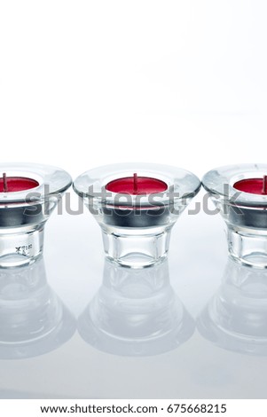 candle holder with red candle on white isolated background.selective focus, shallow depth