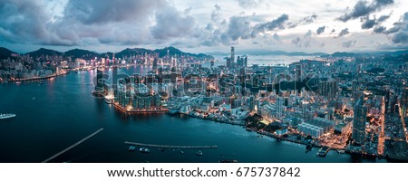 Aerial panoramic view of Hong Kong Island and Kowloon  Royalty-Free Stock Photo #675737842