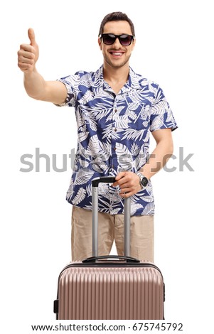 Tourist with a suitcase making a thumb up gesture isolated on white background