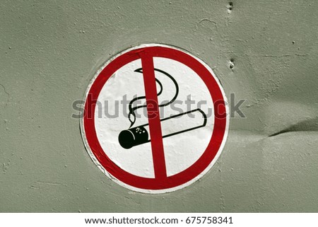No smoking sign on metal wall. Signs and symbols