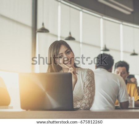 Proud freelance woman posing at office and looking at you / soft focus picture / Vintage concept