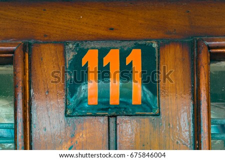 enameled house number one hundred and eleven (111)