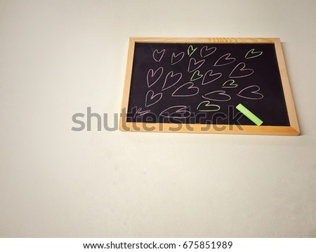 Heart cartoon shape draw by colorful chalk on blackboard. For student,teacher or who want tell love someone.