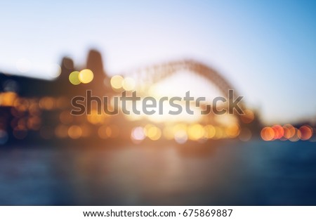 The abstract blurred background (defocus) of Sydney Harbour bridge during the sunset.