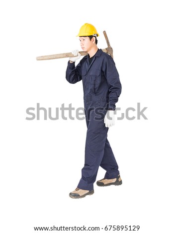 Young man in uniform hold old pick mattock that is a mining device, Cut out isolated on white background