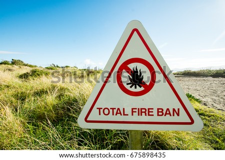 On a beach of the Kapiti Coast a sign indicates a total ban of fires. New Zealand