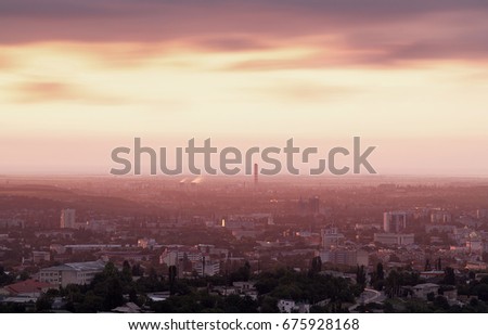 Crimea. Simferopol from a bird's-eye view in the rays of the setting sun. The city is in the backlight. Panorama