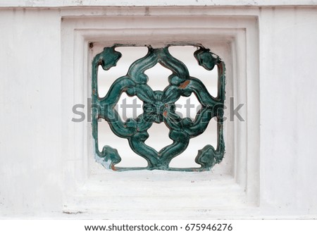 Ancient ceramic pattern. Unseen Buddhism crafts religions handwork on green color ceramic tiles decoration. Porcelain ceramic art on wall at thai temple. Traditional Thai style. - Abstract blur