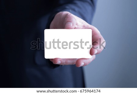 Businessman showing blank businesscard