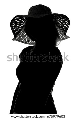 Black and white fashion portrait silhouette of a young woman in a hat with wide brim On white isolated background