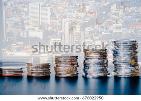 Double exposure of graph and city, Rows of Coins and Blurred, business finance- concept