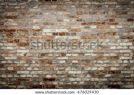 Old red brick wall texture grunge background with vignetted corners