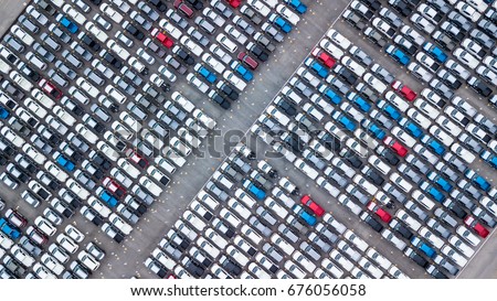 Aerial view new car lined up in the port for import and export business logistic to dealership for sale, Automobile and automotive car parking lot for commercial business  industry. Royalty-Free Stock Photo #676056058