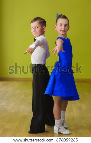 Boy and girl dancing ballroom dance