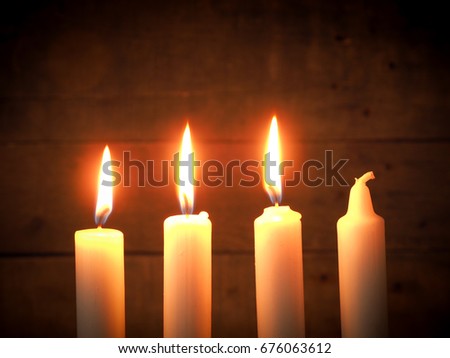 Advent candles on a rustic wooden background, Christmas concept