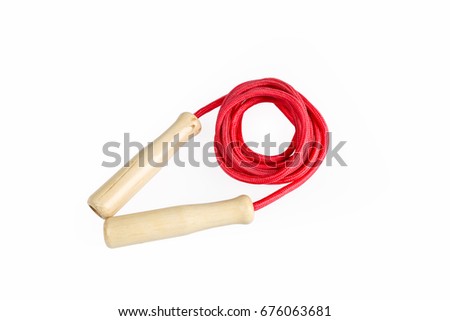 red skipping rope with wooden handles isolated on white with clipping path Royalty-Free Stock Photo #676063681