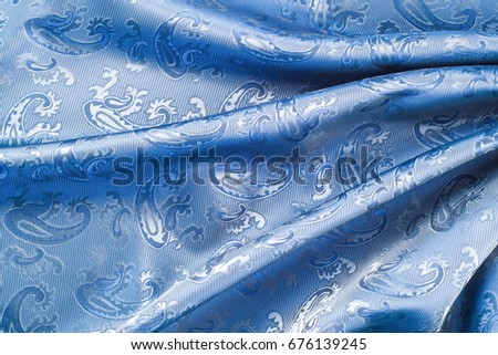 texture lace. a fine open fabric, typically one of cotton or silk, made by looping, twisting, or knitting thread in patterns and used especially for trimming garments.