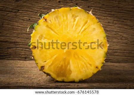 pineapple half on old wood