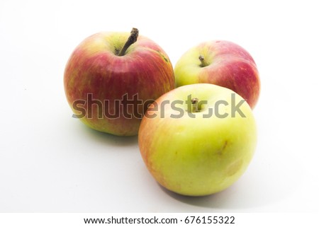 three apple red green on white background