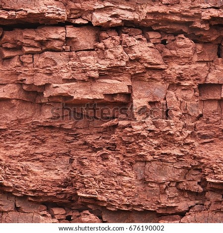 abstract background. Cracks and red layers in natural sandstone as a background. The pattern of the variegated sandstone Geological layers of earth. Sedimentary stone texture closeup.