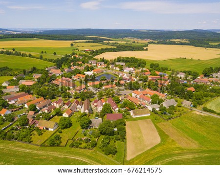 Aerial view of beautiful village in summer countryside. Old village Lipnice in Brdy, Czech republic, Europe. Rundling is a form of circular village. Typical medieval settlement.