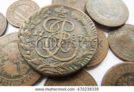 Pile of vintage metall (copper) coins.Coins of the Russian Empire in the background kopyur.Antikvariat.
