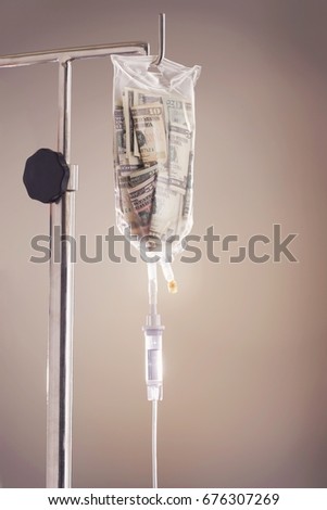 Drip bag on stand, against grey background