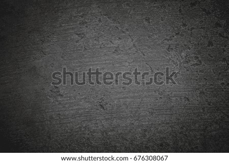 Dark concrete textured wall background.dark edges.copy space for add text.