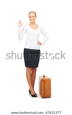 picture of beautiful woman with brown suitcase