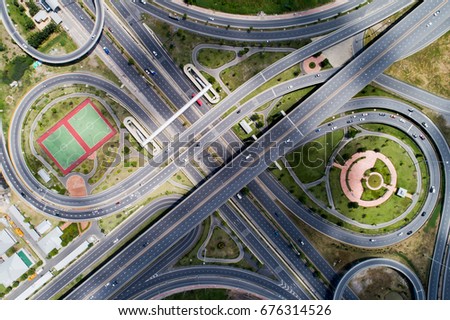 Aerial city view with cross roads and roads, Express ways, buildings, parks and parking lots, bridges. Urban landscape., roads in the city.Aerial city view with cross road and road on air.