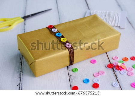 Close up of important day with gift box concept on white wood background, copy space and selective focus.