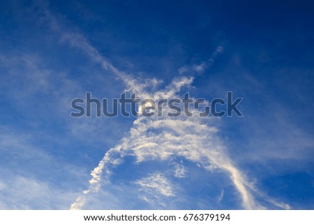 X cross cloud from  Aircraft Trails on blue sky background,Thailand