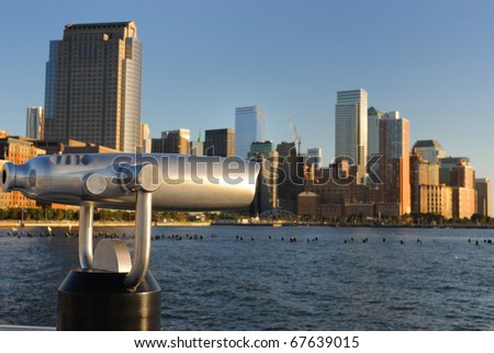 The Lower Manhattan Skyline with a telescope for detailed viewing.