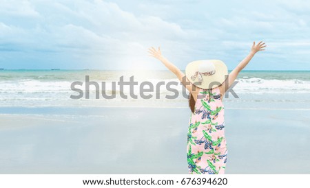 Woman in straw hat on beach