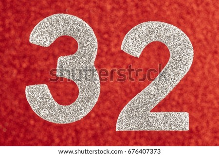 Number thirty-two silver color over a red background. Anniversary. Horizontal