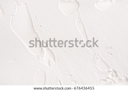 Decorative plaster texture, white relief background with copy space. Stucco surface with abstract pattern. Repair, design, construction concept
