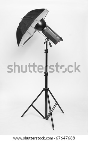 Studio flash with soft-box on a white background.
