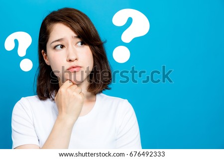 young woman with question marks.