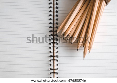 Concept of education pencil and book on table with filter effect retro vintage style
