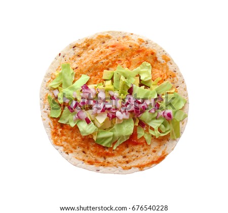 Flour tortilla with vegetables on white background