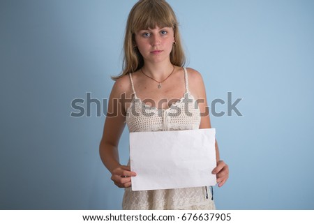 Woman with blank sheet of paper