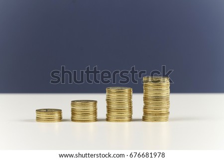 Stacked of coins to show growth of profit in business. 4 rows for quarterly of the year